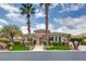 Charming single-story home featuring lush landscaping with beautiful palm trees and manicured greenery at 11527 Morning Grove Dr, Las Vegas, NV 89135