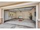 Spacious garage with ample storage cabinets and a unique decorative floor at 11527 Morning Grove Dr, Las Vegas, NV 89135