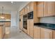Gourmet kitchen with wood cabinets and built-in appliances at 11527 Morning Grove Dr, Las Vegas, NV 89135