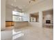 Bright, spacious living area features marble floors, recessed lighting, and a fireplace at 11527 Morning Grove Dr, Las Vegas, NV 89135