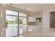 Expansive living room featuring floor-to-ceiling windows, marble floors, and custom trim work at 11527 Morning Grove Dr, Las Vegas, NV 89135