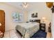 Cozy bedroom with a comfortable bed, side tables, and a window with natural light at 1191 Starstone Ct, Henderson, NV 89014