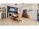 Bright dining room featuring a wooden table, stylish chairs, and a decorative fireplace at 1191 Starstone Ct, Henderson, NV 89014
