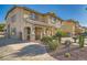 Two-story home with a landscaped yard, covered entry, and welcoming curb appeal at 1191 Starstone Ct, Henderson, NV 89014