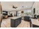 Open kitchen features a center island, stainless steel appliances, and lots of natural light at 1191 Starstone Ct, Henderson, NV 89014