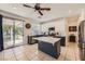 Bright kitchen with a center island, stainless steel appliances, and a sliding glass door to backyard at 1191 Starstone Ct, Henderson, NV 89014