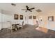 Open loft area with a dining table, carpeted flooring, and access to other rooms at 1191 Starstone Ct, Henderson, NV 89014