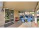 Relaxing covered patio with an outdoor dining set, perfect for entertaining or enjoying the fresh air at 1191 Starstone Ct, Henderson, NV 89014