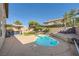 Backyard pool area with lush landscaping, lounge chairs, and plenty of space for relaxation at 1191 Starstone Ct, Henderson, NV 89014