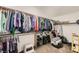 Organized walk-in closet with ample storage, clothing racks, and shelving at 1191 Starstone Ct, Henderson, NV 89014