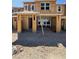 New home construction showing exposed wood framing, windows, and covered parking area in the community at 128 Silver Run Ln, Las Vegas, NV 89138