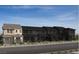 New townhome construction showing multiple units and modern architectural details in a desirable community at 128 Silver Run Ln, Las Vegas, NV 89138