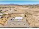 Wide aerial view featuring a desert home surrounded by land and mountainous scenery at 1410 Tiptop Trl, Pahrump, NV 89048
