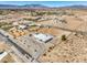 Stunning aerial view of the property with expansive land and surrounding desert landscape at 1410 Tiptop Trl, Pahrump, NV 89048
