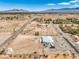 Spacious aerial view of a home on a large lot in a rural community, showcasing a beautiful landscape at 1410 Tiptop Trl, Pahrump, NV 89048