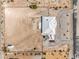 Overhead aerial perspective of a home and expansive lot surrounded by desert terrain at 1410 Tiptop Trl, Pahrump, NV 89048