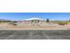 Lovely exterior with xeriscaped front yard, concrete driveway, and white tile roof at 1410 Tiptop Trl, Pahrump, NV 89048