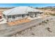 Spacious single story home boasts a xeriscaped yard and a white tile roof, offering both style and low-maintenance living at 1410 Tiptop Trl, Pahrump, NV 89048
