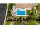 Aerial view of backyard featuring a pool, spa, outdoor patio, landscaping and grassy area at 145 Austin Rose Ave, Henderson, NV 89002