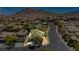 Neighborhood aerial view showcasing lush greenery, scenic streets, desert landscaping and mountain views at 145 Austin Rose Ave, Henderson, NV 89002