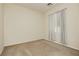 Bright, neutral bedroom featuring a soft carpet and light-filtering curtains at 145 Austin Rose Ave, Henderson, NV 89002