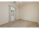 Empty bedroom with a neutral carpet and a window with light-filtering curtains at 145 Austin Rose Ave, Henderson, NV 89002