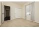 Neutral bedroom with a sliding closet and an open doorway at 145 Austin Rose Ave, Henderson, NV 89002