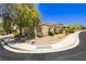 Beautiful view of a well-maintained home with landscaped grounds and mature trees at 145 Austin Rose Ave, Henderson, NV 89002