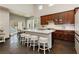 Modern kitchen featuring a large center island with seating, stainless steel appliances, and ample cabinet space at 145 Austin Rose Ave, Henderson, NV 89002
