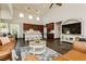 Open concept living space featuring high ceilings, large windows, and seamless transition to the kitchen at 145 Austin Rose Ave, Henderson, NV 89002