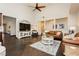 Bright living room with vaulted ceiling, neutral paint, and dark floors provides a relaxing atmosphere at 145 Austin Rose Ave, Henderson, NV 89002