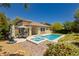 Backyard featuring a swimming pool, hot tub, outdoor furniture, and desert landscaping at 145 Austin Rose Ave, Henderson, NV 89002