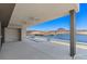 Inviting covered patio with stunning views of the tranquil lake and surrounding landscape at 1548 Pleasant Bay Ct, Henderson, NV 89011