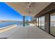 Expansive patio with ceiling fans, overlooking a pool, lake and mountain views at 1548 Pleasant Bay Ct, Henderson, NV 89011