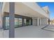 Spacious covered patio with lake views, and access to the home's luxurious interiors at 1548 Pleasant Bay Ct, Henderson, NV 89011