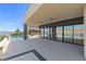 Large back patio featuring ceiling fans, views of the lake, and an inviting pool area at 1548 Pleasant Bay Ct, Henderson, NV 89011