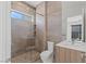 Modern bathroom with glass shower, updated fixtures, and tile surround at 1548 Pleasant Bay Ct, Henderson, NV 89011
