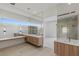 Contemporary bathroom showcasing large mirrors, floating vanities, and sleek fixtures at 1548 Pleasant Bay Ct, Henderson, NV 89011