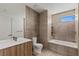 Bathroom featuring a bathtub, a glass-enclosed shower, and modern vanity at 1548 Pleasant Bay Ct, Henderson, NV 89011