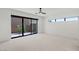 A simple bedroom has access to a cozy courtyard and features a ceiling fan at 1548 Pleasant Bay Ct, Henderson, NV 89011