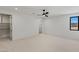 Spacious bedroom features modern ceiling fan, walk-in closet, and large window at 1548 Pleasant Bay Ct, Henderson, NV 89011
