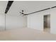 Spacious primary bedroom featuring modern ceiling fan, and glass enclosed shower at 1548 Pleasant Bay Ct, Henderson, NV 89011