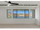 Bright bedroom with lake views, modern lighting, and neutral carpeting at 1548 Pleasant Bay Ct, Henderson, NV 89011