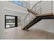 Stylish entryway featuring floating staircase, open concept design, and contemporary finishes at 1548 Pleasant Bay Ct, Henderson, NV 89011