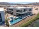 Stunning modern home with a pool and hot tub overlooking the lake and mountains at 1548 Pleasant Bay Ct, Henderson, NV 89011
