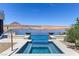 Inviting hot tub with serene lake views, perfect for relaxation and enjoying the scenery at 1548 Pleasant Bay Ct, Henderson, NV 89011