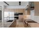 Modern kitchen features stainless steel appliances and a beautiful countertop island with a sink at 1548 Pleasant Bay Ct, Henderson, NV 89011