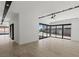 Spacious living room with tile floors, recessed lighting, and large sliding glass doors to the outdoors at 1548 Pleasant Bay Ct, Henderson, NV 89011