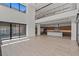 Expansive living area with lake view, modern staircase, and open to gourmet kitchen at 1548 Pleasant Bay Ct, Henderson, NV 89011