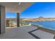 Serene patio view overlooking the lake and mountains, creating a peaceful retreat at 1548 Pleasant Bay Ct, Henderson, NV 89011